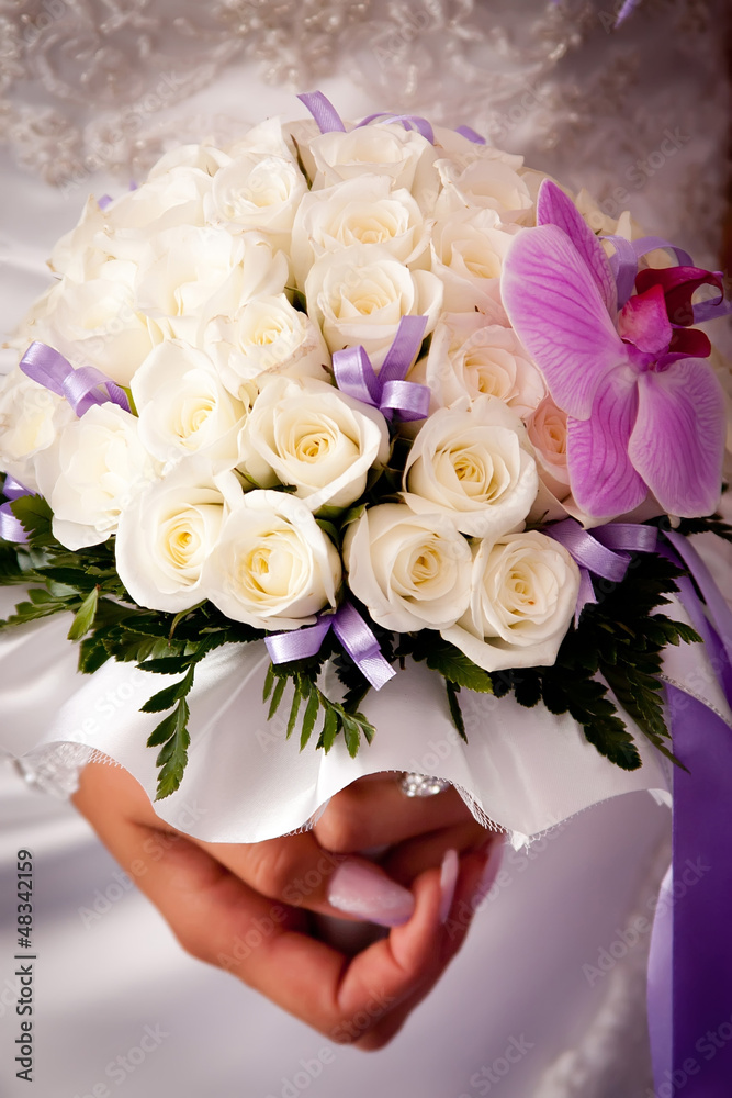 Bride holding wedding flowers