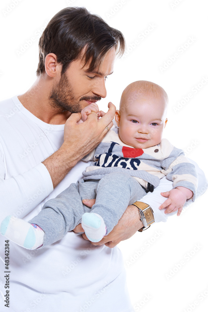 Young father cradling his baby on his arm Young father cradling his baby on his arm