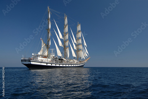 Sailing frigate under full sail in the ocean