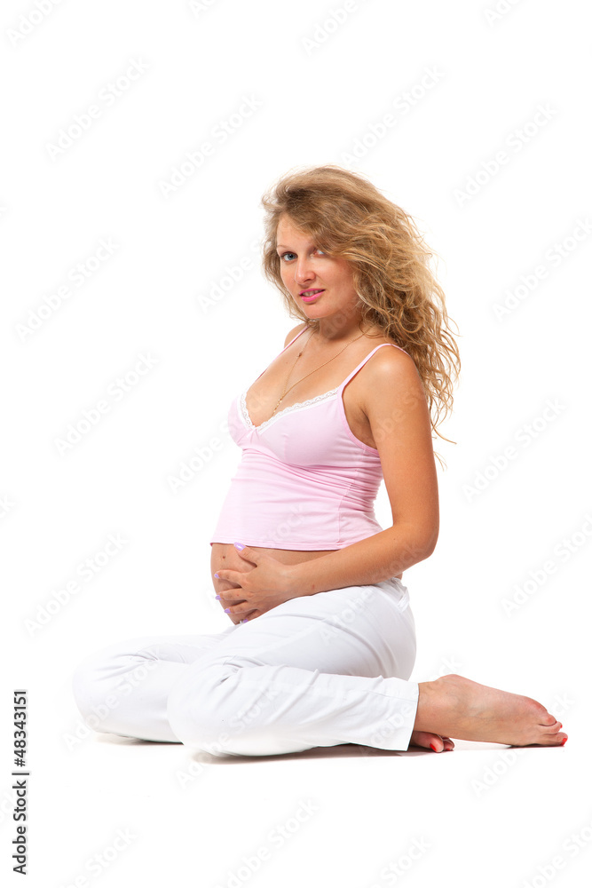 Pregnant woman is caressing her belly Pregnant woman is caressing her belly