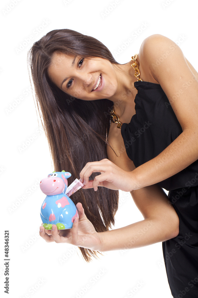 beautiful young woman smiling with a cow piggy bank beautiful young woman smiling with a cow piggy bank