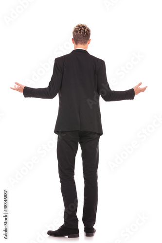 full body back view of a business man welcoming