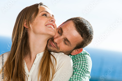 Cute young couple hugging.