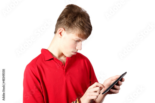teenage boy using a digital tablet pc © aigarsr
