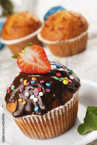 Chocolate muffin with strawberry on top