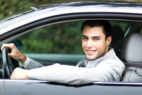 Handsome man driving his car