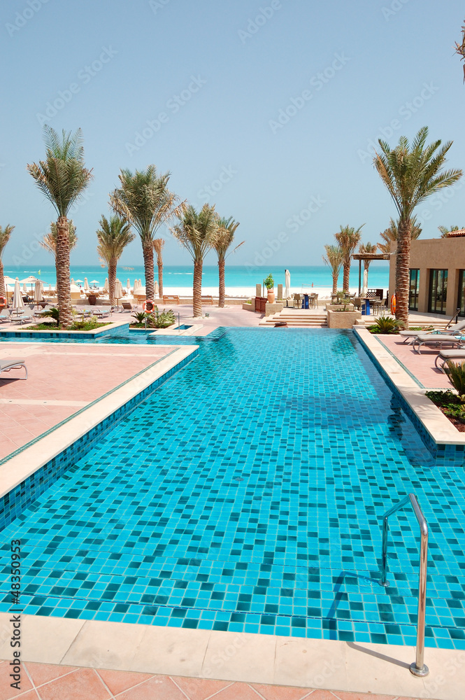 Swimming pool at the beach of luxury hotel, Saadiyat island, Abu