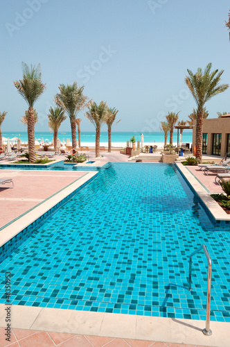 Swimming pool at the beach of luxury hotel  Saadiyat island  Abu