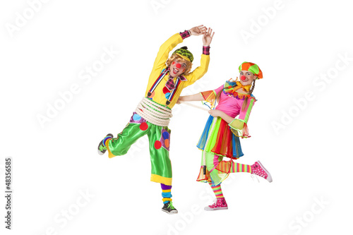 Two smiling clowns isolated over a white background