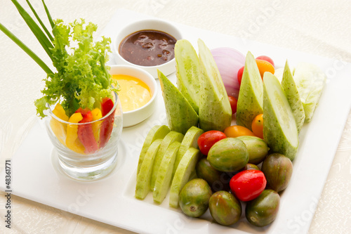 A delicious fresh vegetable tray with dip.