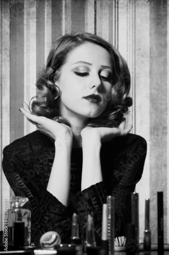 Woman applying cosmetics