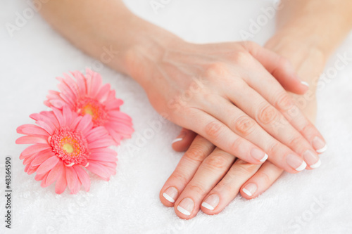Flowers with french manicured fingers © WavebreakmediaMicro