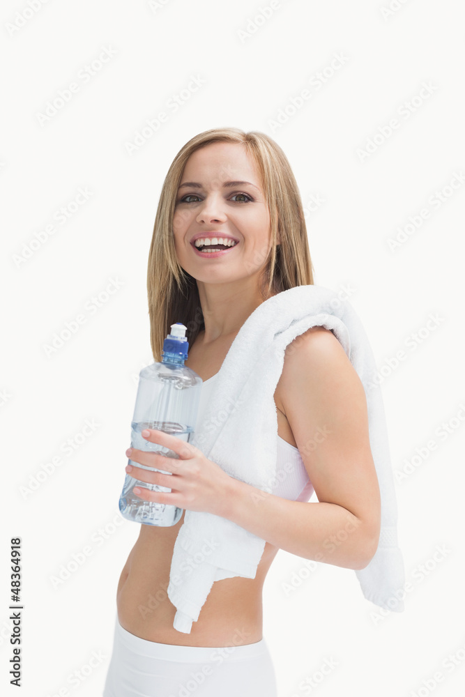 Portrait of happy woman with towel holding water bottle Portrait of happy woman with towel holding water bottle