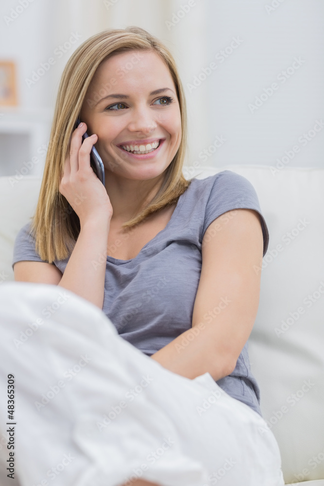 Casual happy woman using cellphone at home Casual happy woman using cellphone at home