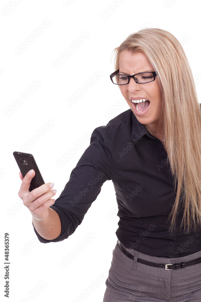 Angry woman yelling at her mobile Angry woman yelling at her mobile