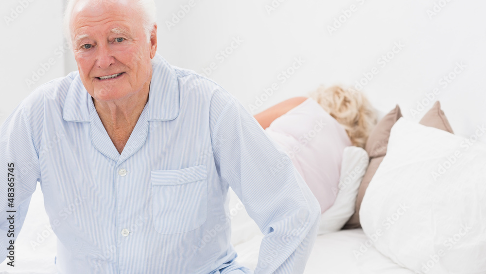 Old man sitting while woman sleeping Old man sitting while woman sleeping
