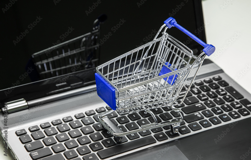 Online Shopping. Shopping cart on a keyboard.