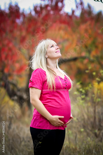 Young beautiful pregnant woman with long hair.