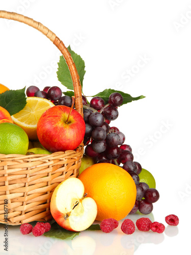 Assortment of exotic fruits in basket  isolated on white