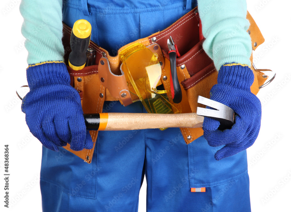 Male builder in blue overalls with gavel isolated on white Male builder in blue overalls with gavel isolated on white
