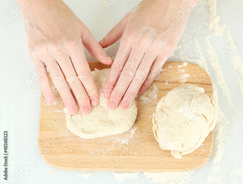 Preparing pizza dough isolated on white