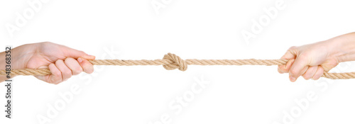 Hands pull rope isolated on white