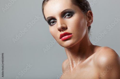 woman face closeup portrait with smoky eyes
