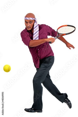 business man playing tennis