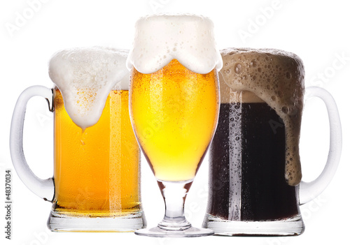 Frosty glass of light and dark beer set isolated