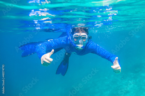 Girl swimming under water
