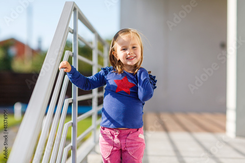 Photos Portrait of little pretty laughing girl