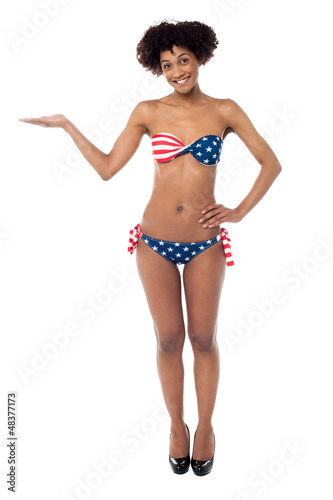 USA flag bikini model presenting copy space