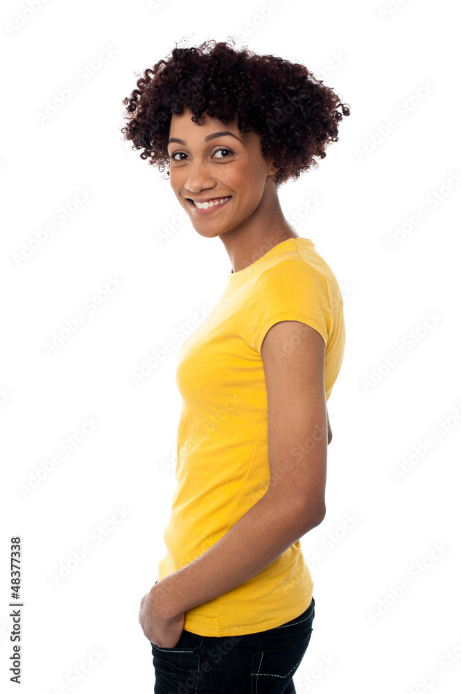Pretty woman wearing yellow top and jeans Pretty woman wearing yellow top and jeans