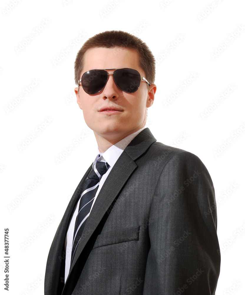 portrait of young man wearing a suit and sunglasses portrait of young man wearing a suit and sunglasses