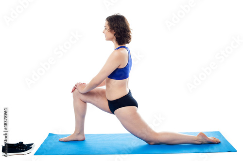 Woman performing aerobics, indoor studio shot