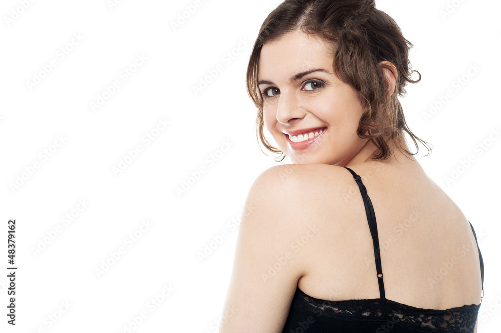 Fototapeta premium Smiling beauty turning her face towards the camera