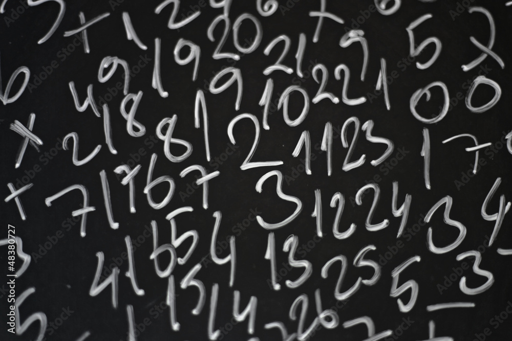 Random numbers written in chalk on a blackboard
