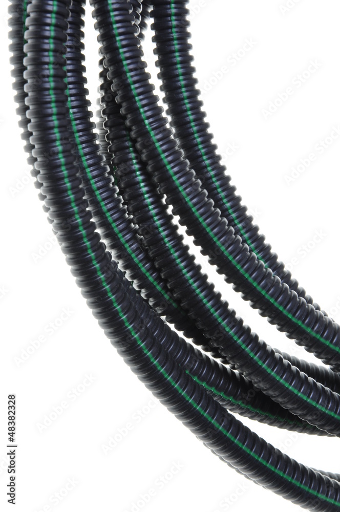 Black corrugated pipe with a green line for electrical cables
