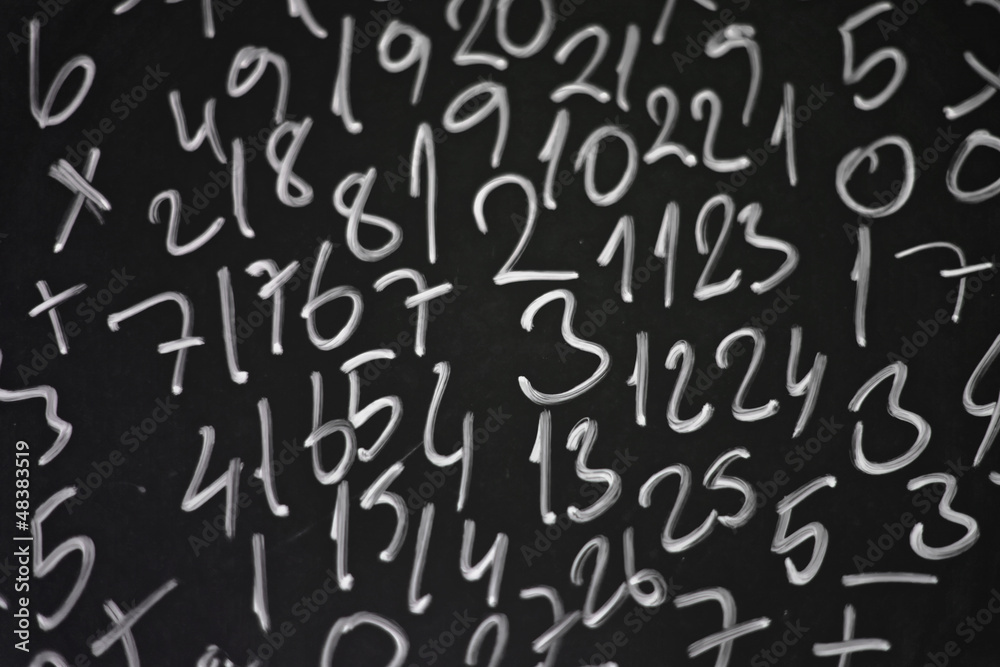 Random numbers written in chalk on a blackboard