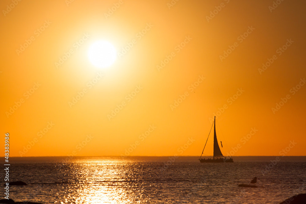 Sailing boat with beautiful sunset