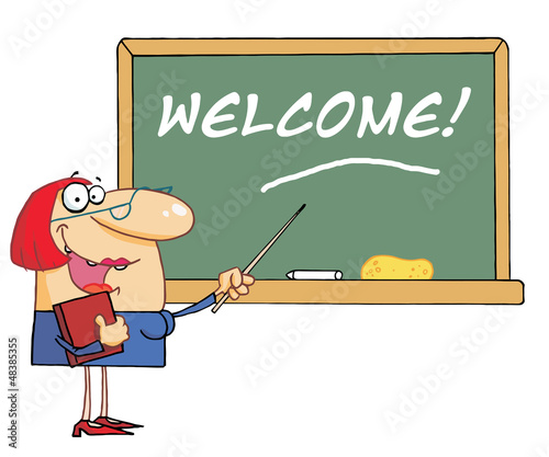 Woman Teacher Pointing To A Welcome Chalkboard