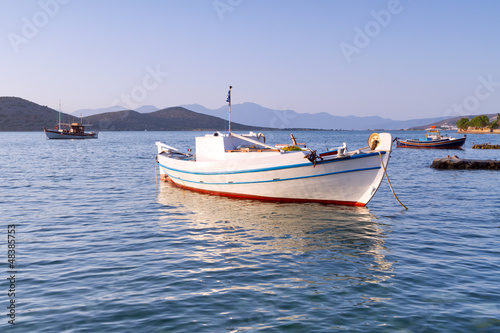 White Greek boat at the coast of Crete © Patryk Kosmider