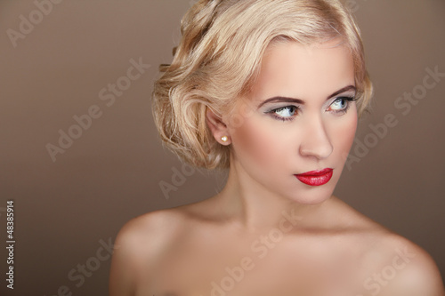Beauty Woman Portrait with wavy blond hair style