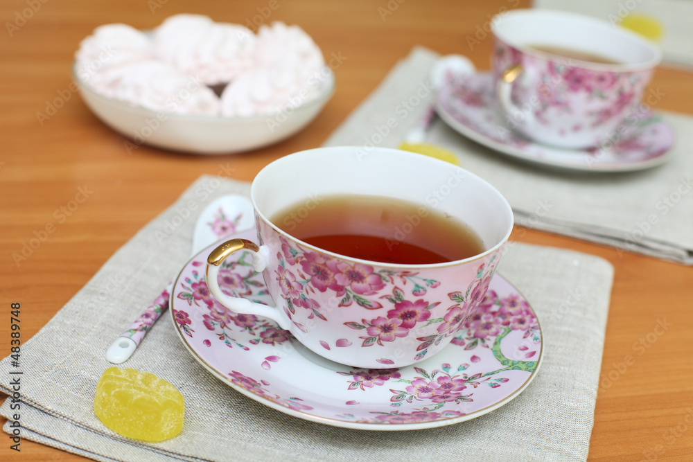 Romantic tea served in beautiful cups with marshmallow Romantic tea served in beautiful cups with marshmallow