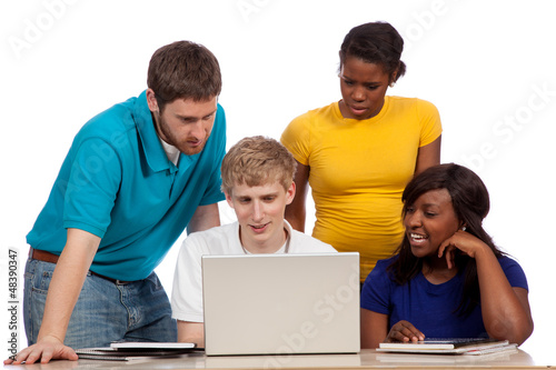 Diverse group of college students/friends looking at a computer