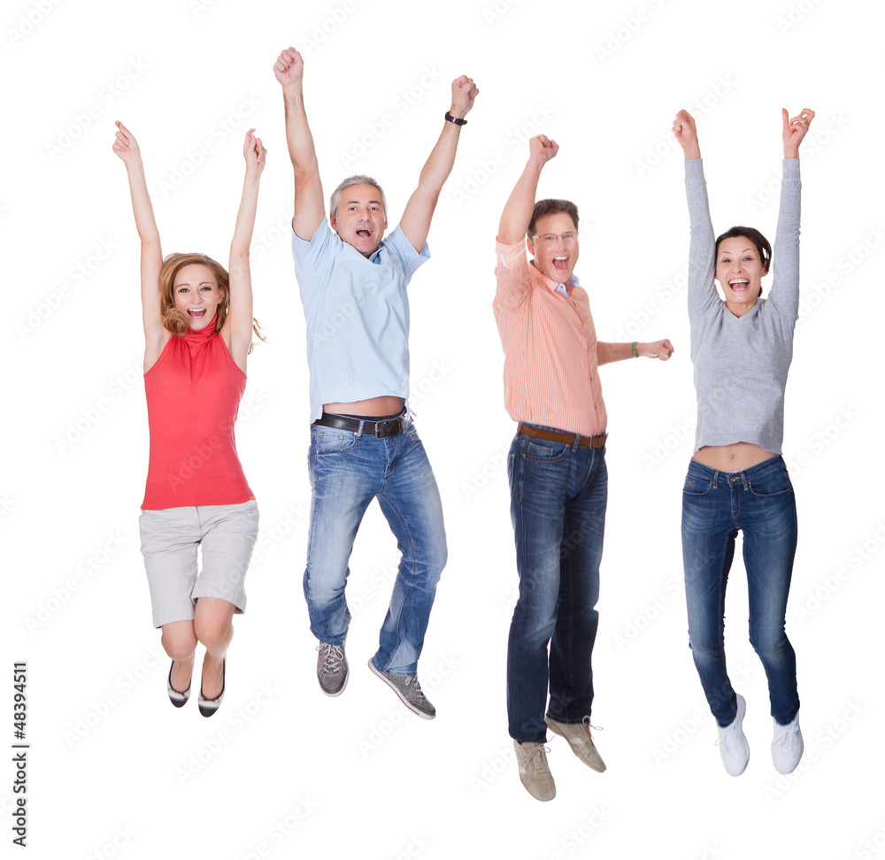 Happy couples jumping in the air rejoicing Happy couples jumping in the air rejoicing