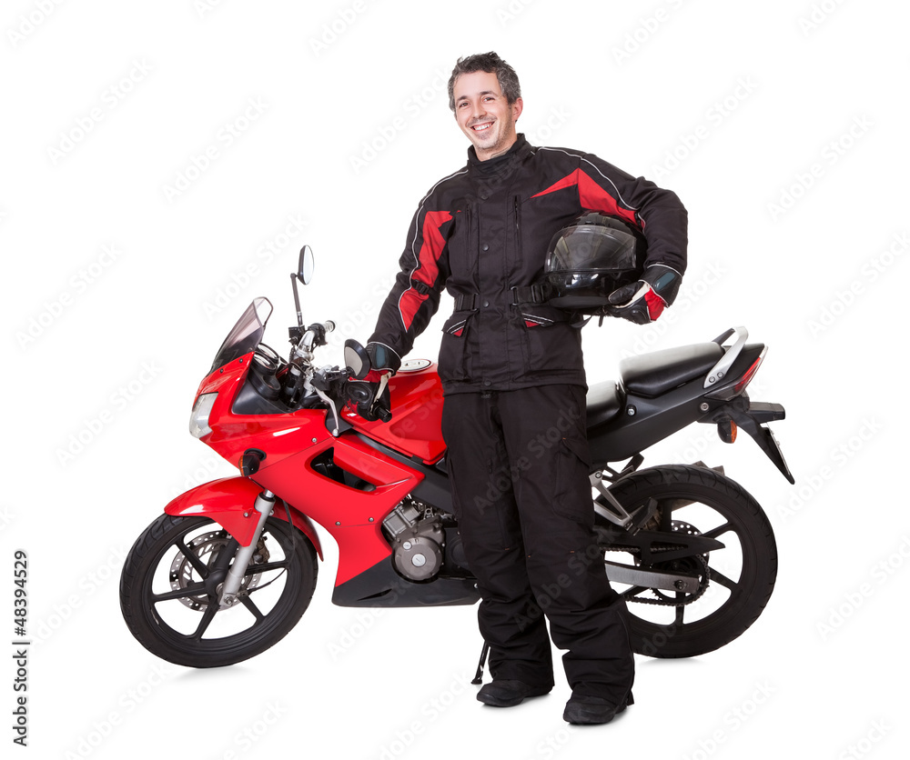 Man in protective gear with his motorbike Man in protective gear with his motorbike