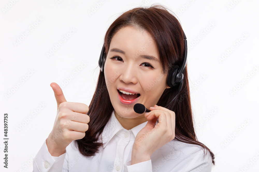Smiling call center operator business woman show thumbs Smiling call center operator business woman show thumbs