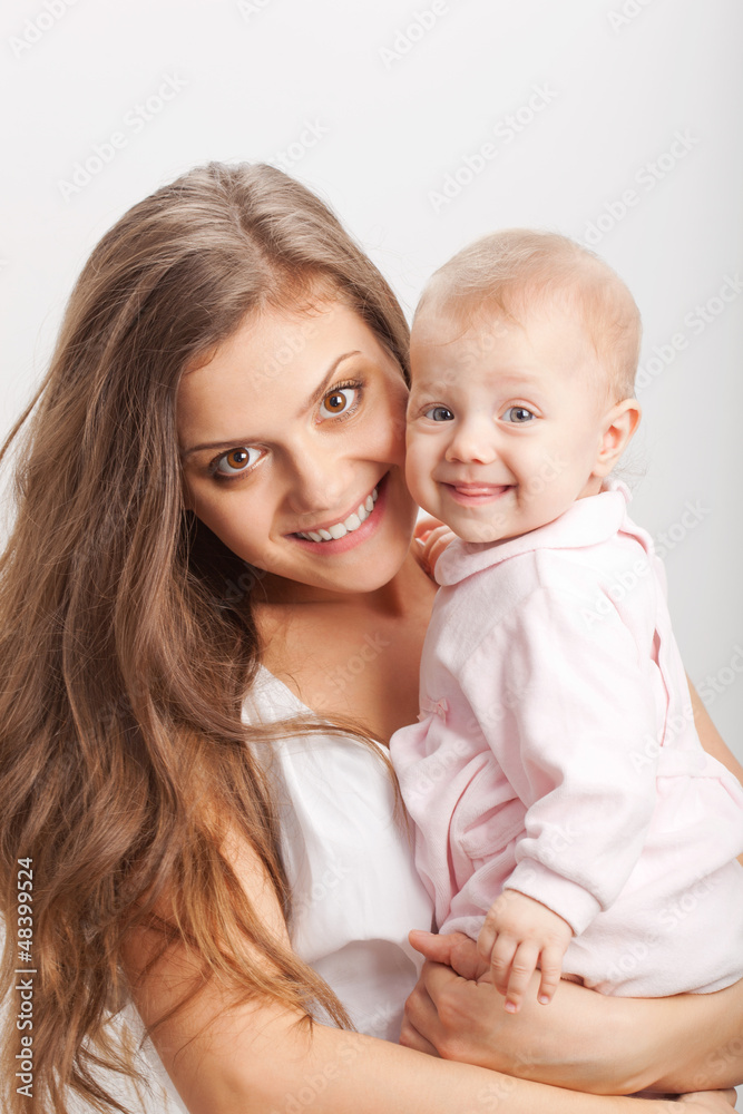 young mother holding her baby girl on hands young mother holding her baby girl on hands