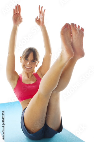 young fitness woman doing pilates exercise